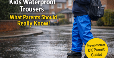 Child wearing bright waterproof overtrousers splashing in puddles on a rainy UK street
