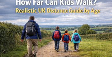 Family with children of different ages walking along a countryside trail in the UK with backpacks on a cloudy day