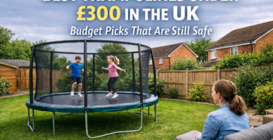 Children playing on a budget garden trampoline with safety enclosure in a UK family garden