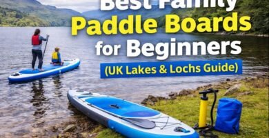 Family paddle boarding on a calm Scottish loch with inflatable SUP and gear on the shore, promoting beginner paddle boards for UK lakes and lochs