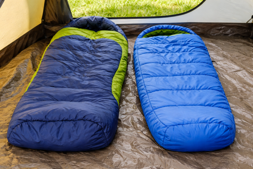 Two kids sleeping bags side by side showing correct junior fit versus oversized bag with excess foot space